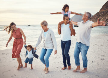 Family on a beach laughing together