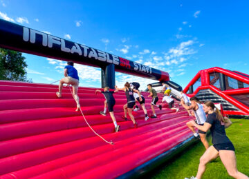 People running on the inflatable obstacle course