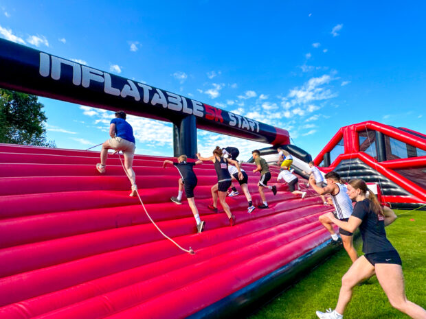 People running on the inflatable obstacle course