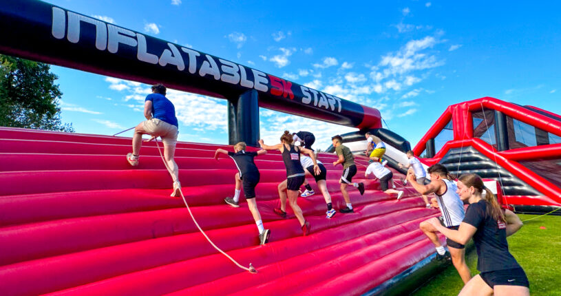 People running on the inflatable obstacle course