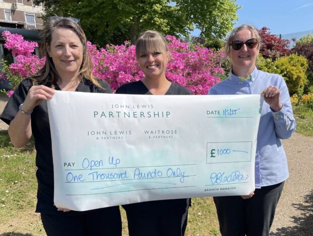 Karen Crockett, Senior Occupational Therapist, Anne Dexter, Occupational Therapy Manager and Linda Blackshaw, Community Matters Lead from Waitrose Holsworthy, hold a cheque for £1,000