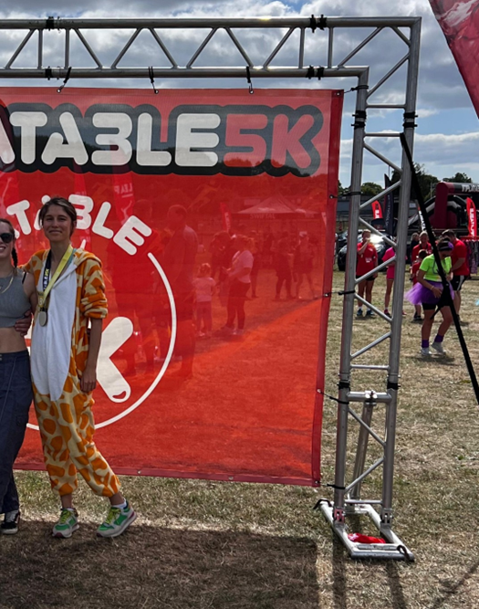Zoe in her giraffe costume at the Exeter 5K Inflatable.
