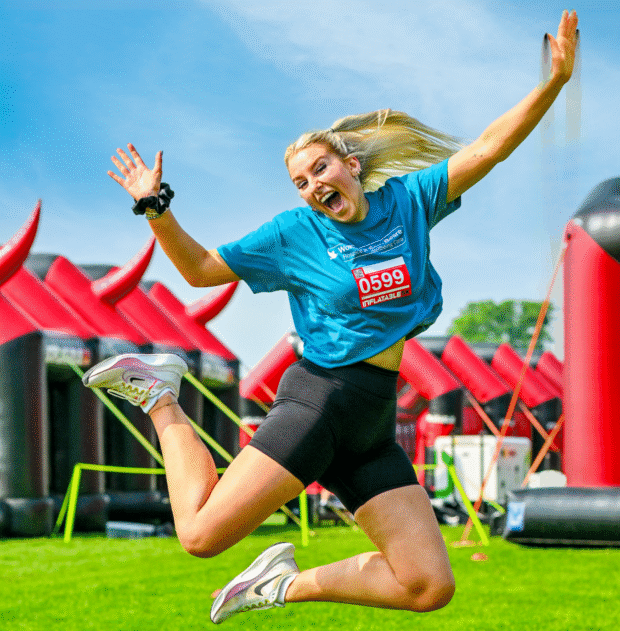 Someone celebrating at the 5K Inflatable Event
