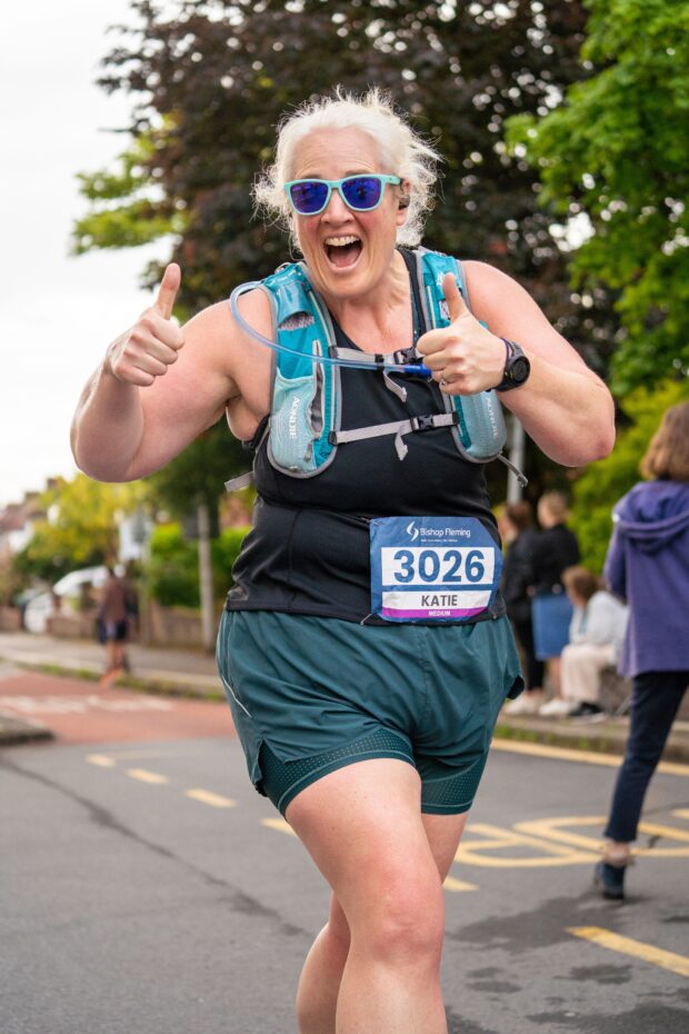 Runner giving a thumbs up at the event.