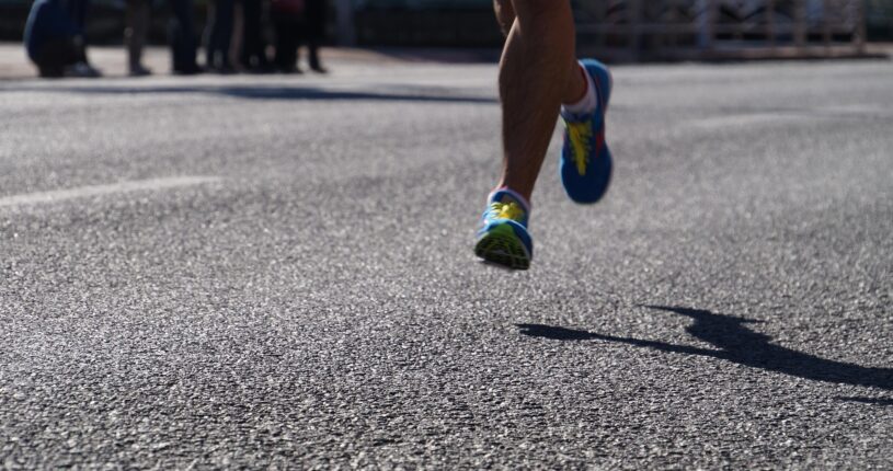 Picture of someones feet running a marathon.