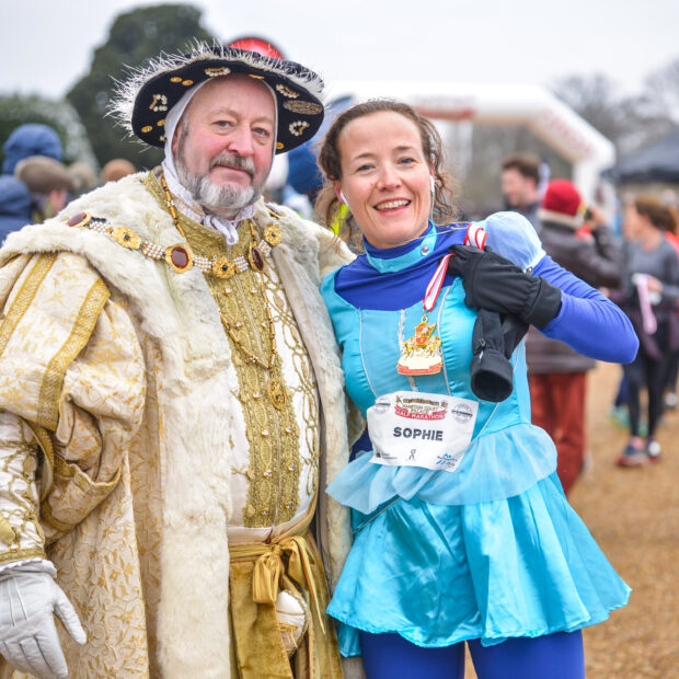 2 runners at the Hampton Court Half Marathon dressed up in fancy dress costumes from Tudor times.