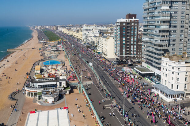 Picture of Brighton Beach taken from above of the spectators lining the street.